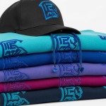 Stack of hoodies and caps featuring consistently stitched chenille-textured logos all from the same digitized file.