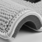 Detailed shot of chenille patch edge showing stabilized foam and secure satin border.
